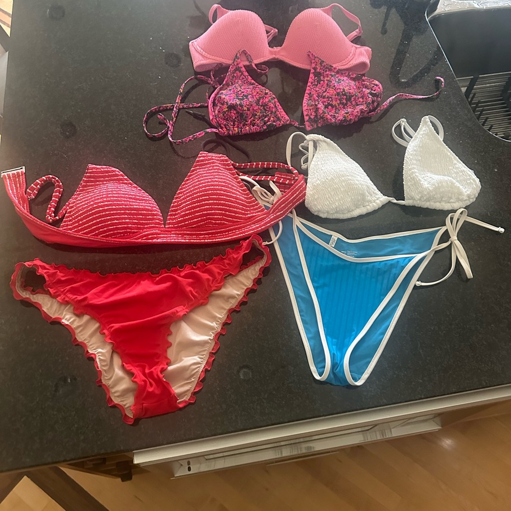 Bathing suits. Two swim suits and two extra tops L/XL. $30